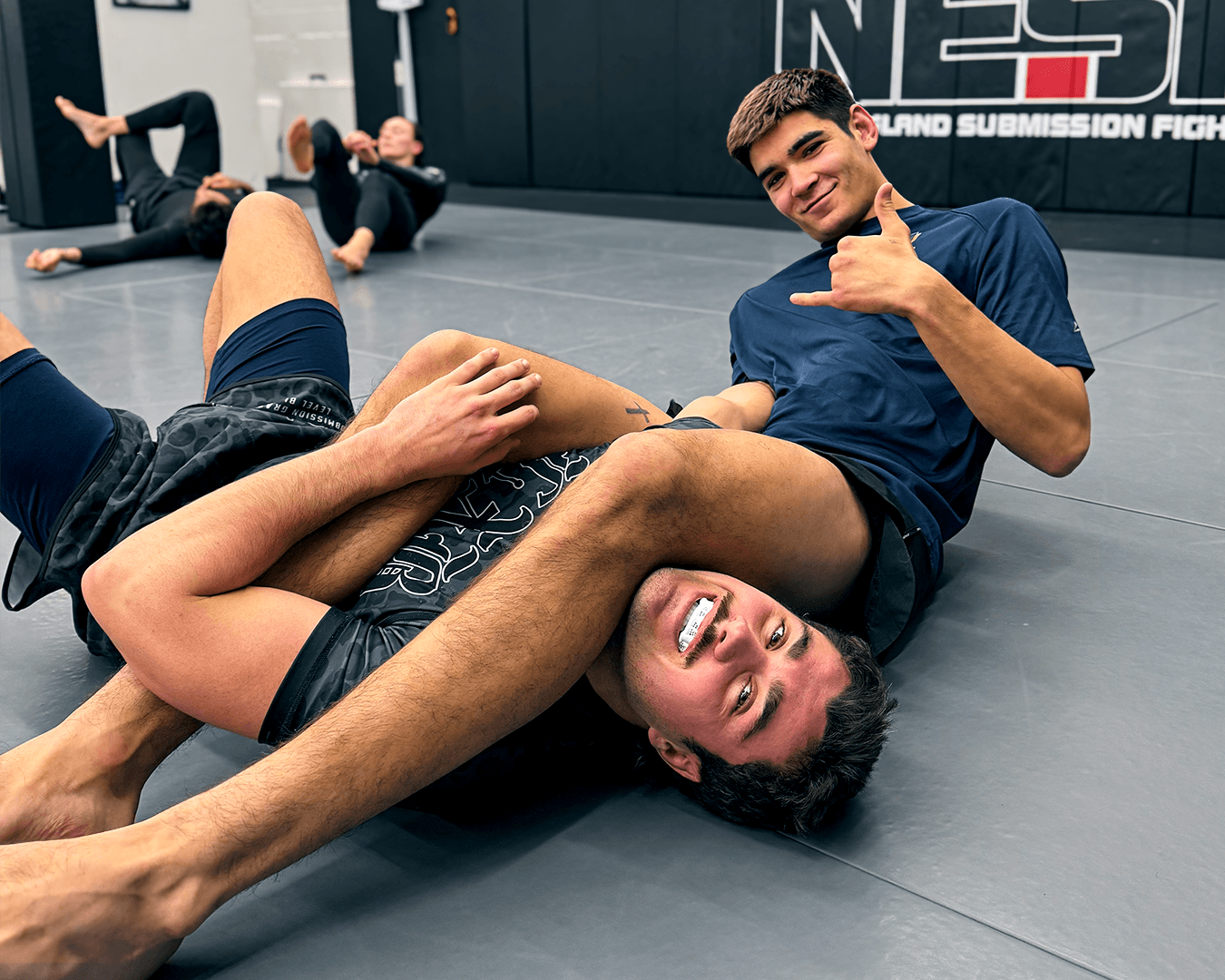 Two students drilling the armbar.