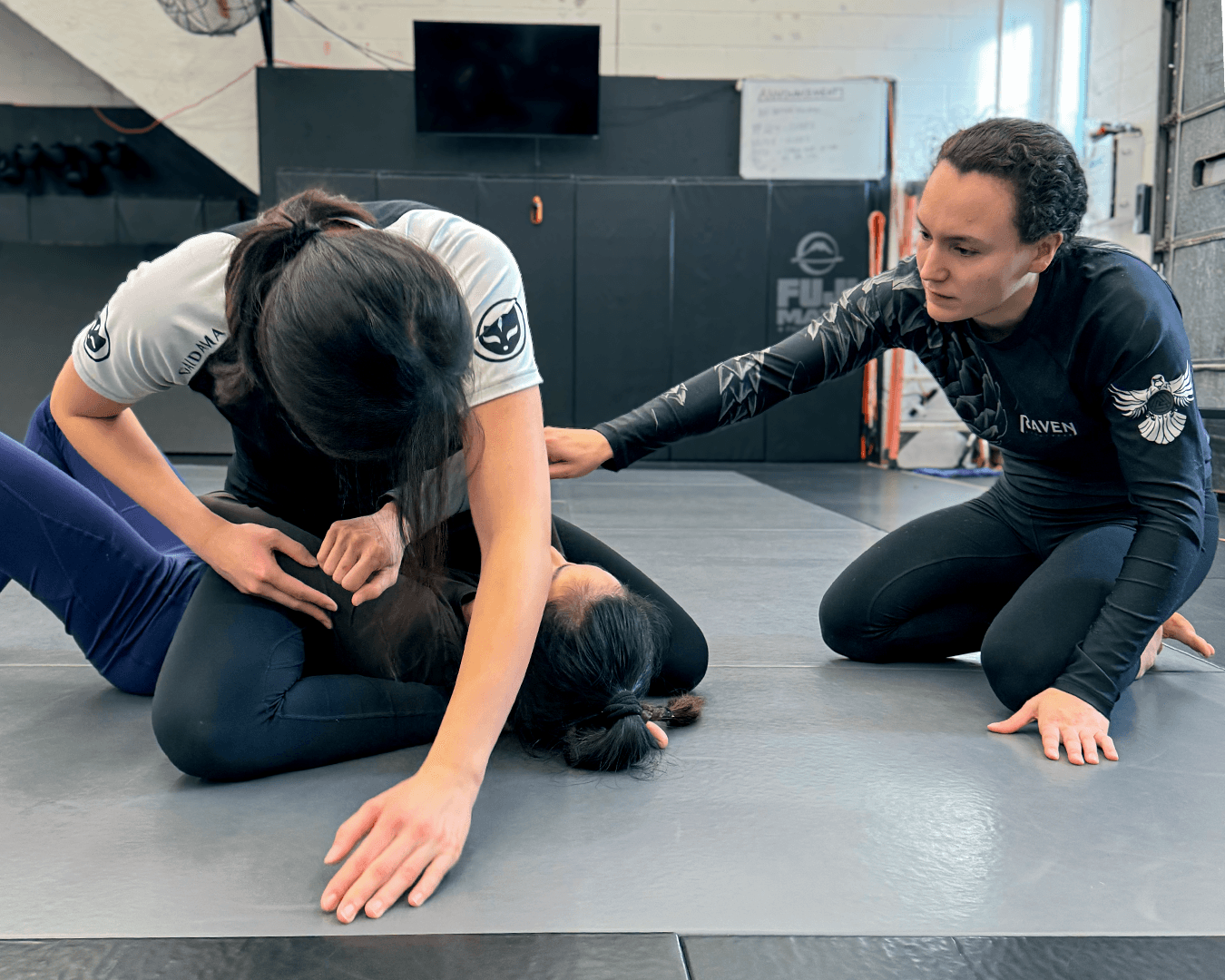 Two women training self-defense together.