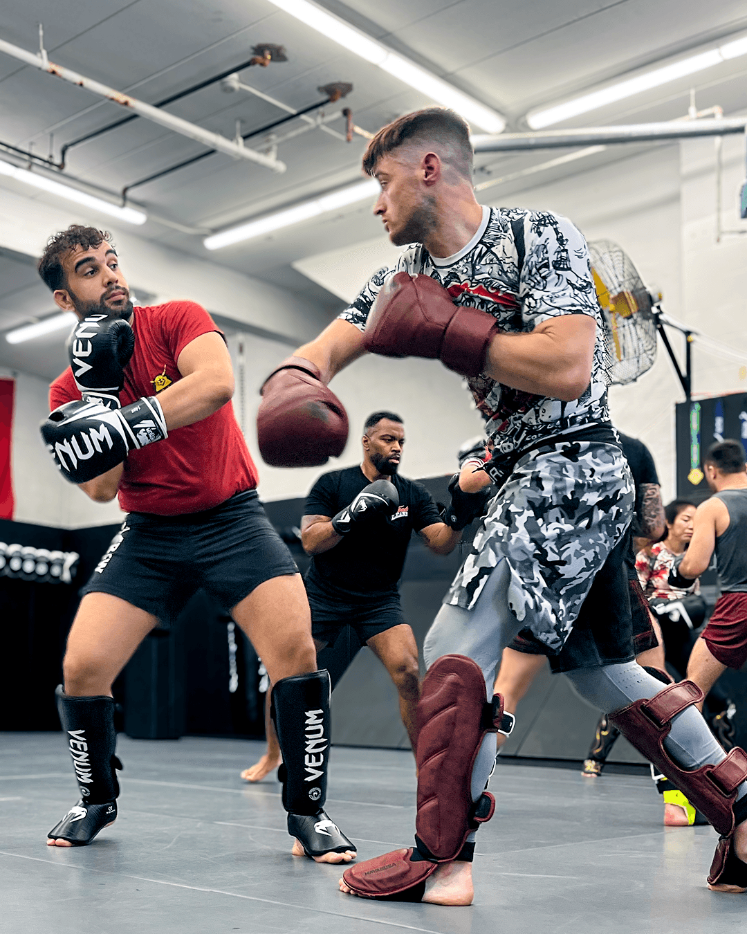 Students drilling MMA technique.